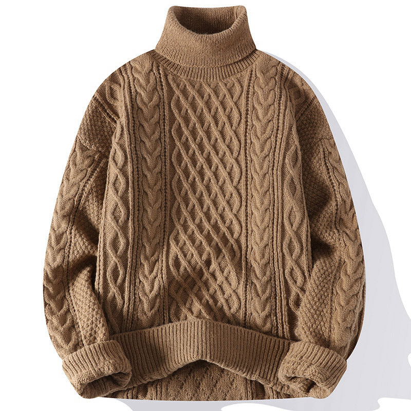 Brown cable knit sweater on a white background