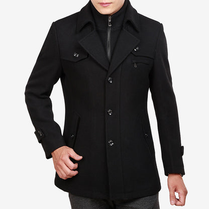Black coat worn by a person on a white background