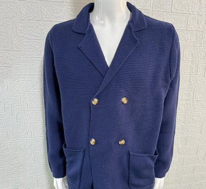 Blue blazer with gold buttons on a mannequin against a textured white background