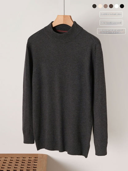 Dark gray turtleneck sweater on a wooden hanger against a light background