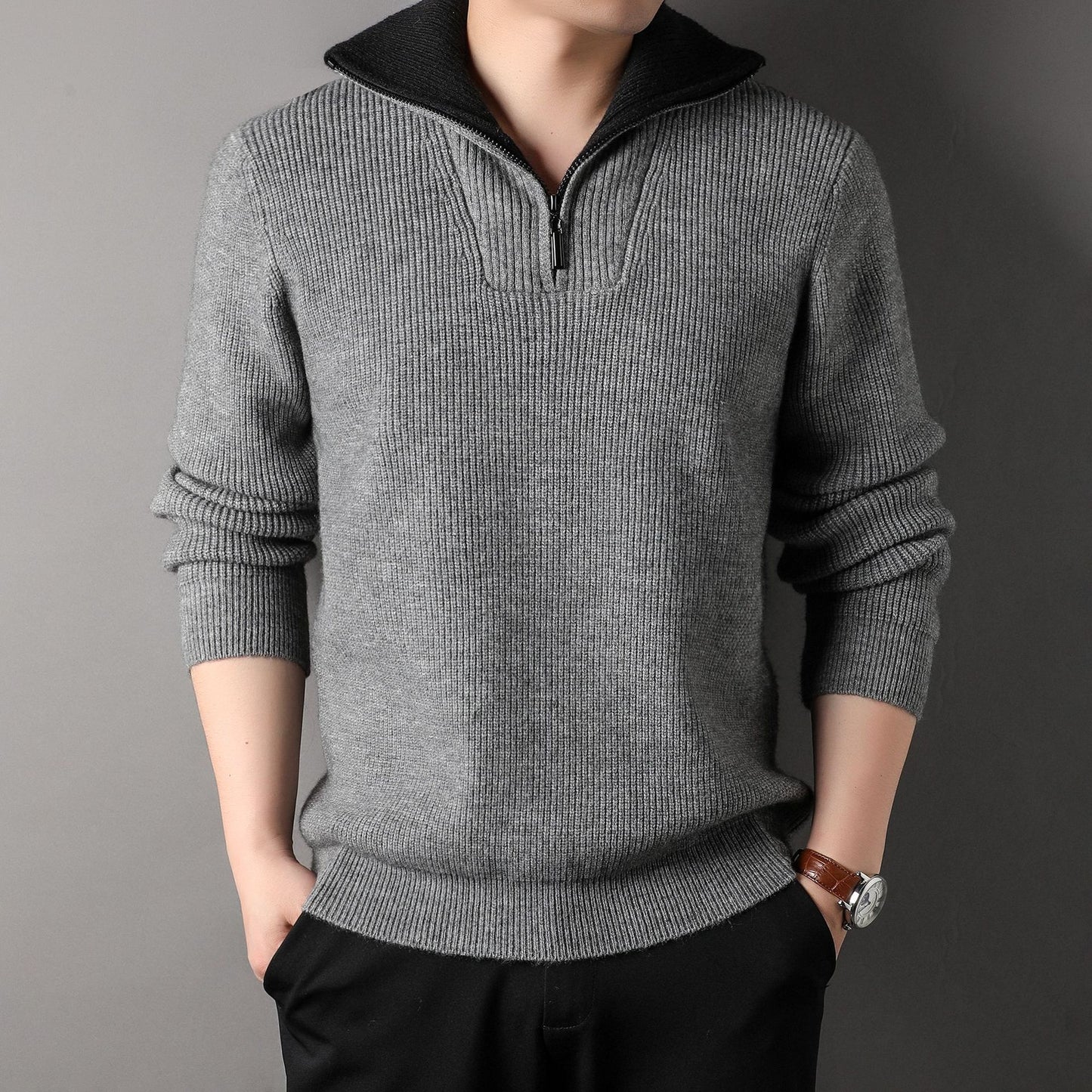 Gray sweater worn by a person on a gray background
