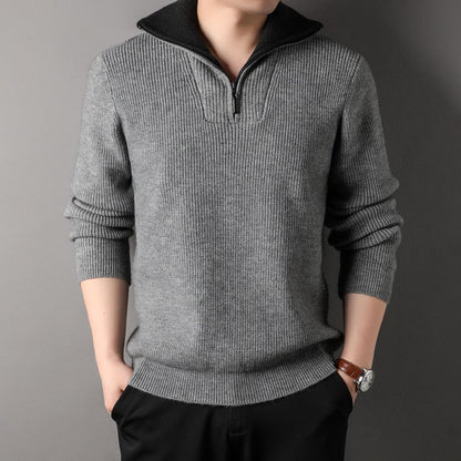 Gray sweater worn by a person on a gray background