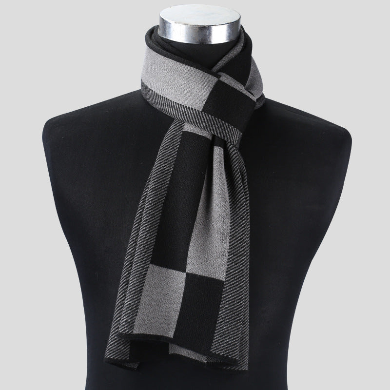 Gray checkered scarf on a black mannequin bust against a light gray background