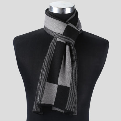 Gray checkered scarf on a black mannequin bust against a light gray background
