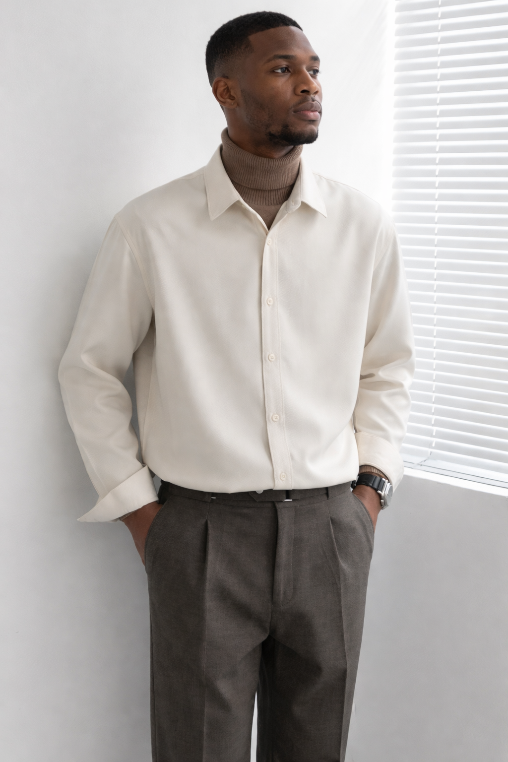 Man wearing a beige long sleeve shirt