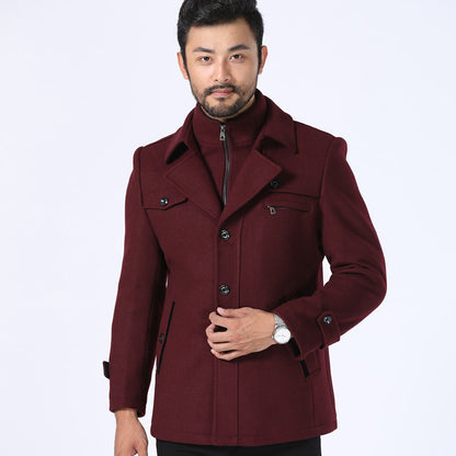 Man wearing a burgundy coat on a white background