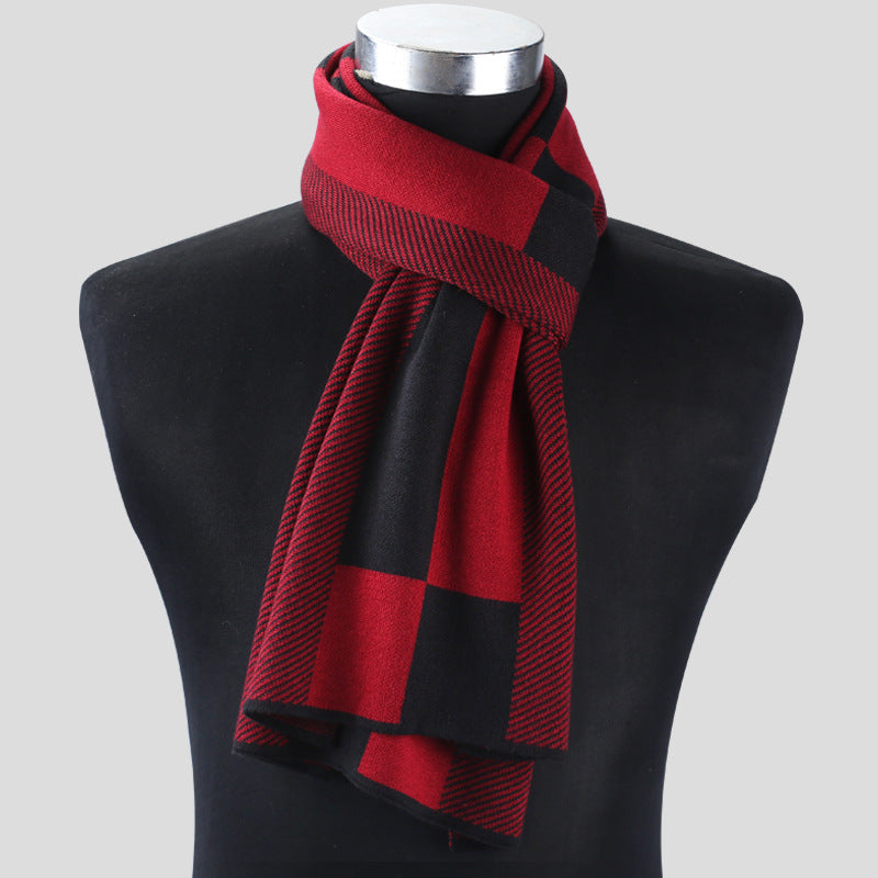 Red and black checkered scarf on a mannequin against a gray background