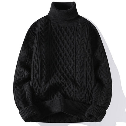 Black cable knit sweater on a white background