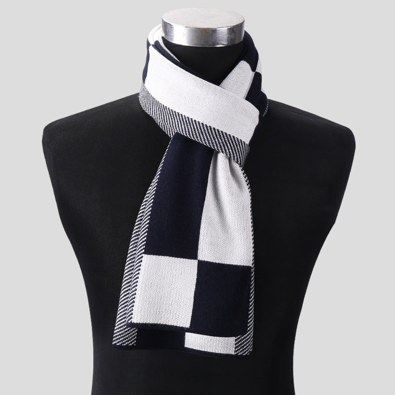 Black and white checkered scarf on a mannequin against a gray background