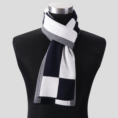 Black and white checkered scarf on a mannequin against a gray background